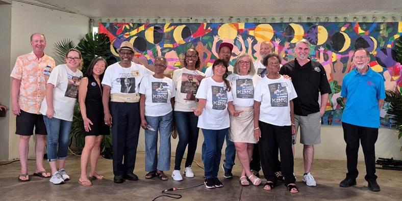 A group of people posing for a photo

Description automatically generated